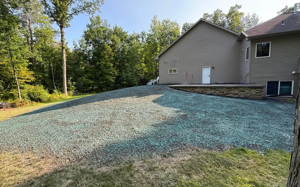 Erosion control hydroseed application stabilizing soil on a residential slope in Wisconsin